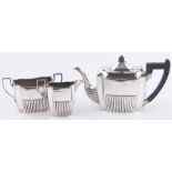 A late Victorian silver 3-piece batchelor's teaset, of half fluted square form, Sheffield 1897, 18.