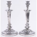 Pair of ornate 19th century French silver candlesticks, with acanthus embossed decoration,