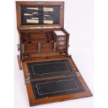 A Victorian light oak stationery cabinet, with fold-out writing slope enclosing fitted drawers,