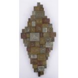 A bronze-patinated resin relief wall plaque by Giovanni Schoeman (South African 1940-1980),