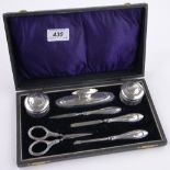 A 6-piece silver mounted manicure set, by William Devenport, Birmingham 1918, cased.