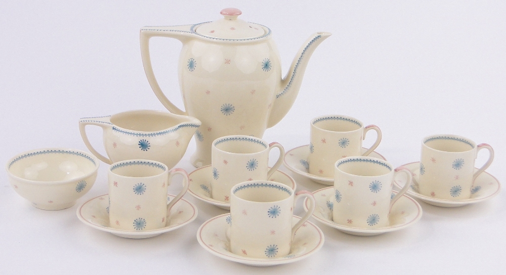 A Susie Cooper coffee service for 6-people, with painted blue and pink star designs,