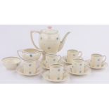 A Susie Cooper coffee service for 6-people, with painted blue and pink star designs,