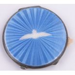 A circular silver and blue enamel RAF Wings decorated compact, Birmingham 1939, diameter 6.5cm.