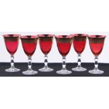 A set of 6 Venetian gilded ruby glass wine glasses, height 18cm, diameter 9.5cm.