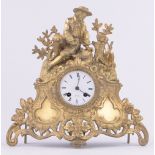 A 19th century gilt metal cased mantel clock, surmounted by a fisherman,