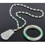 A Chinese relief carved green jade pendant on jade chain, and a Chinese jade bangle, (2).