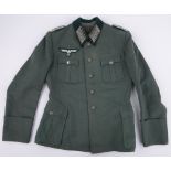 A German Second World War Admin Officer's tunic, with tailor's label and dagger straps.