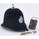 A Policeman's helmet circa 1959, together with lamp and whistle, (3).