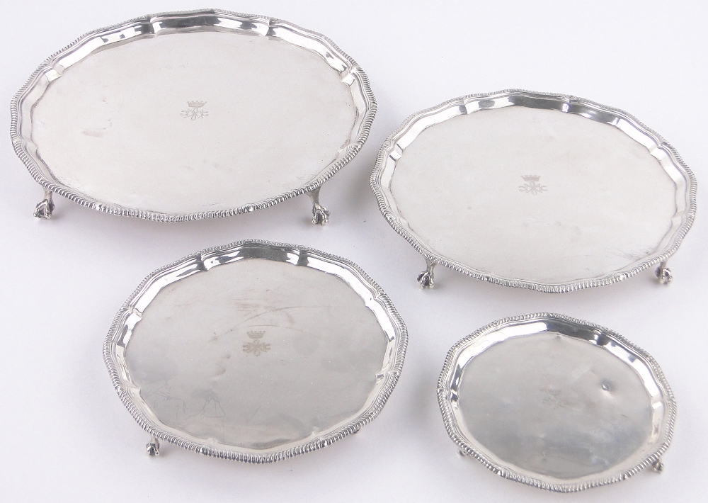 A set of 4 graduated circular silver salvers,