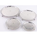 A set of 4 graduated circular silver salvers,