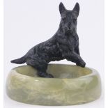An Austrian cold painted bronze Terrier mounted on an onyx bowl, stamped Austria,