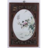 A Chinese Famille Rose porcelain wall plaque, painted flowers and locus with text,