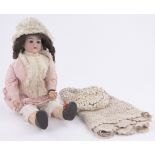 A German bisque headed doll, stamped Made in Germany 300, open mouth with composition limbs,