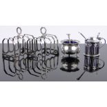 A pair of small silver toast racks and 2 silver cruet items, (4).