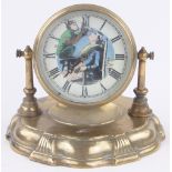 A brass drum cased mantel clock with automaton monkey barber dial, on brass plinth base,
