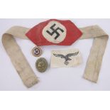 A German Second War Period armband, enamelled badge and military badge, (3).