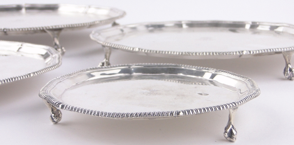 A set of 4 graduated circular silver salvers, - Image 3 of 3