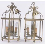 A pair of brass framed hexagonal lantern light fittings, with bevel glass panels,