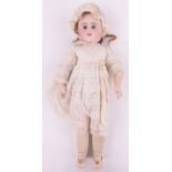 A French porcelain headed doll, stamped E10D, composition limbs, height 59cm.