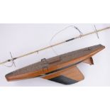 A scratch-built wooden hulled Vintage pond yacht, with mask, length 90cm.