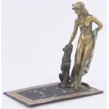 A cold painted bronze nude woman and panther, marked under base, height 16cm, rug length 16cm.