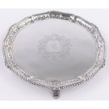 A late Victorian circular silver salver, cast gadrooned edge on bracket feet, makers marks G M J,