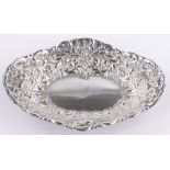 A Victorian chase and embossed oval silver table centre bowl, London 1890, 5.5oz, length 25cm.