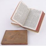 A silver mounted pocket prayer book, and a relief carved wood cased travelling photo frame,