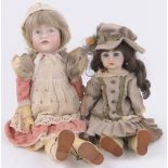 A German K & R Pouty doll, composition limbs, height 50cm and a French Jumeau doll, height 37cm,