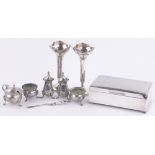 A group of silver items, including a cigarette box,