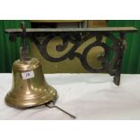 A bell with iron wall mounting bracket.
