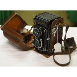 A Ricoh Diacord leather cased camera.