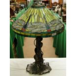 A Tiffany style table lamp with dragonfly design shade.