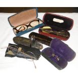 5 Cased pairs of Vintage spectacles and a leather spectacle case.