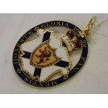 A double-sided enamelled medallion.