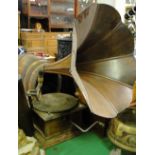 A Piania oak cased wind-up gramophone with original ribbed bentwood horn.