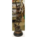 A large French patinated spelter figure "Commerce" on separate plinth.