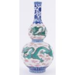 A Chinese porcelain double gourd vase, with painted enamel dragon designs, painted seal mark under,