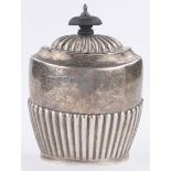 An Edwardian oval silver tea caddy, of half fluted form, Birmingham 1911, height 11cm.