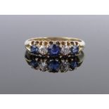 An 18ct gold 5 stone sapphire and diamond ring, size O.
