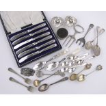 A cased set of silver handled knives, various silver souvenir spoons,