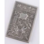 A Chinese silver card case circa 1900, relief decorated front depicting figures in gardens,