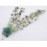 A carved jade amethyst and semi precious stone multiple strand necklace,