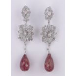Pair of large 18ct white gold diamond set earrings with large facet-cut natural rubies below,