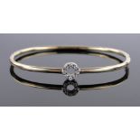 An 18ct gold diamond set bangle, diamond content approx. 0.2cts, 7.1g.