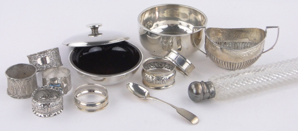 A group of silver items, including circular box and cover, circular sugar bowl,