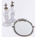 A French moulded glass and ormolu toilet mirror circa 1900, supported by a pair of country figures,