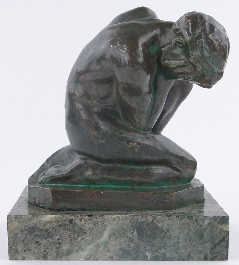 Eugene Bourgouin (1880-1924), a dark green patinated bronze study of a crouching woman,