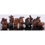 A group of Oriental carved fruit wood netsukes, (11).